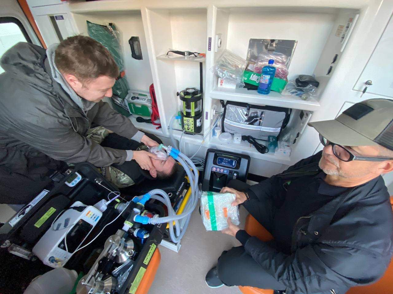 Man in ambulance with resuscitation device
